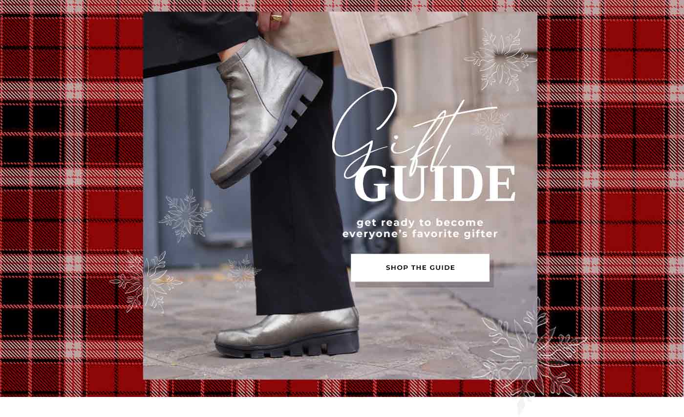 Welcome to our 2022 gift guide. Picture of a woman pulling on her Hadirat bootie, a lug sole bootie in a soft, metallic leather upper