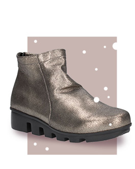 Hadirat, a lug sole, pull-on ankle bootie in the softest metallic leather